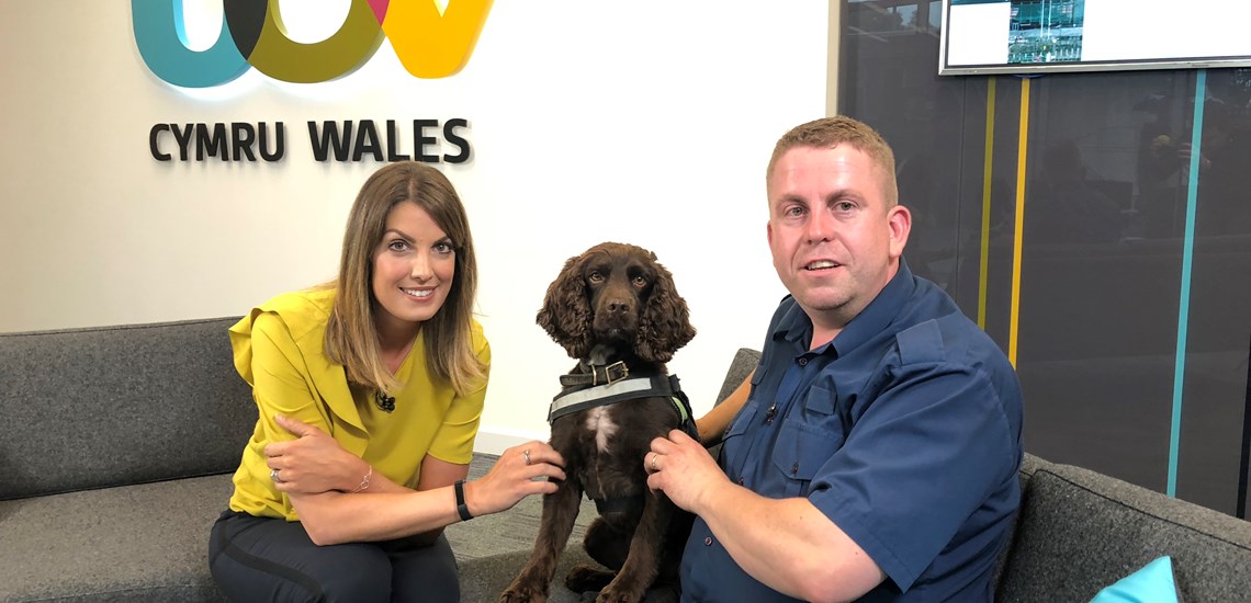 Stuart Phillips and sniffer dog YOYO with ITV Wales News Presenter Andrea Byrne